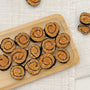 Chicken and seaweed sushi-roll bites for dogs arranged on a wooden tray – handmade dog treats
