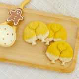 Golden corgi butt-shaped chicken cookies on a white plate – handmade pumpkin dog treats